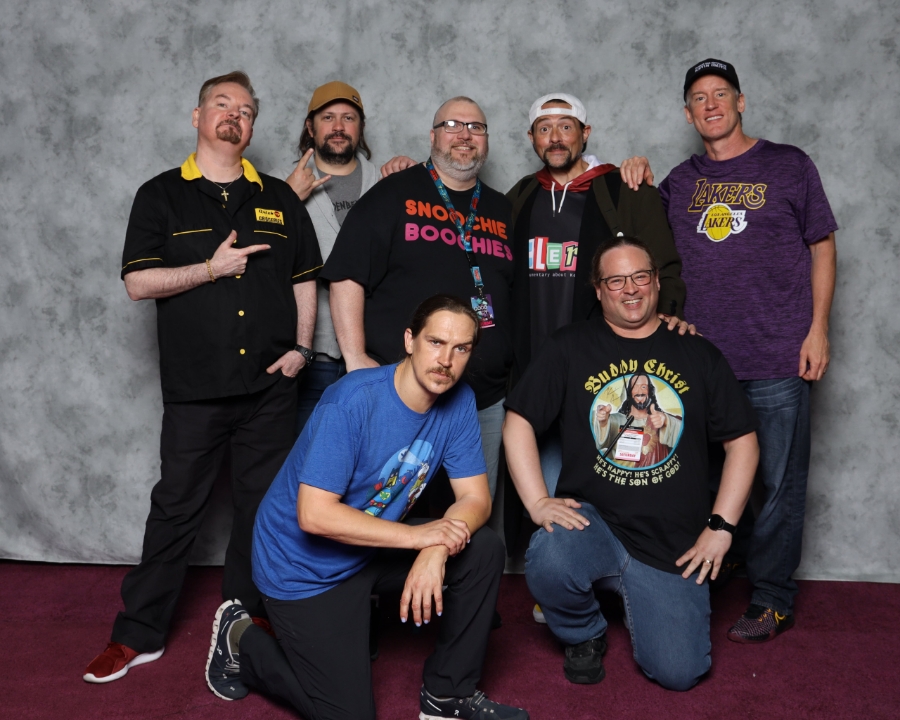 Billy posing in a photo with the cast of Clerks